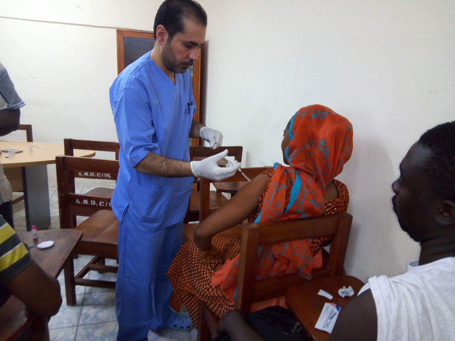 Doctor Vaccinating The Woman